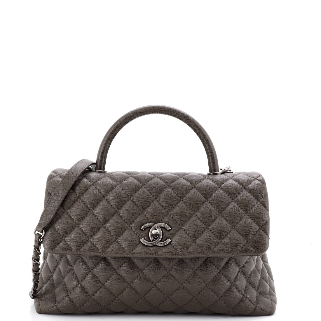 Chanel Coco Top Handle Bag Quilted Caviar (Medium): The Chanel Coco Top Handle Bag in Quilted Caviar reads at first glance as architecture rather than accessory. Caviar is Chanel's pebbled, harder-wearing calfskin, named for its grain rather than the f