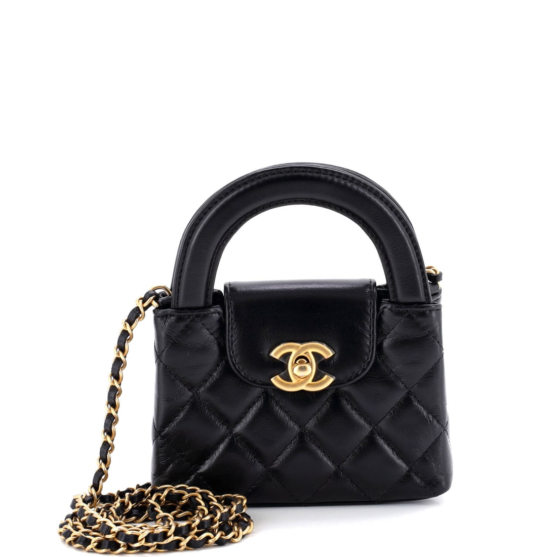 Chanel Kelly Top Handle Shopping Bag Quilted Shiny Aged Calfskin (Nano): The Chanel Kelly Top Handle Shopping Bag in Quilted Shiny Aged Calfskin is among the more covetable readings of the model in the current Chanel library, in size Nano. The quilted shiny aged calfskin f