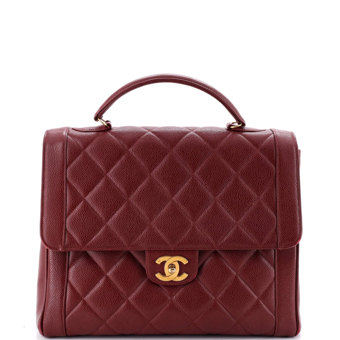 Chanel Vintage Two-Tone Kelly Top Handle Bag Quilted Caviar (Jumbo): The Chanel Vintage Two-Tone Kelly Top Handle Bag in black quilted caviar with gold hardware sits at the model's Jumbo proportion - a structured, top-handle silhouette that pre-dates the more commonly 