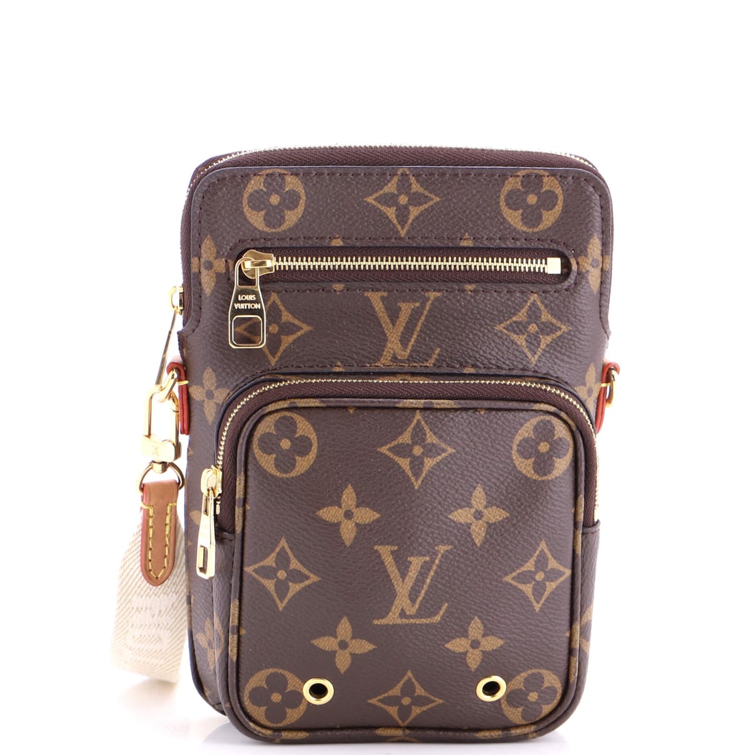 Louis Vuitton Utility Phone Sleeve Bag Monogram Canvas: A measured working bag in Louis Vuitton's idiom, finished with the attention a serious example asks for. The lot is catalogued as the Louis Vuitton Utility Phone Sleeve Bag Monogram Canvas. It carries