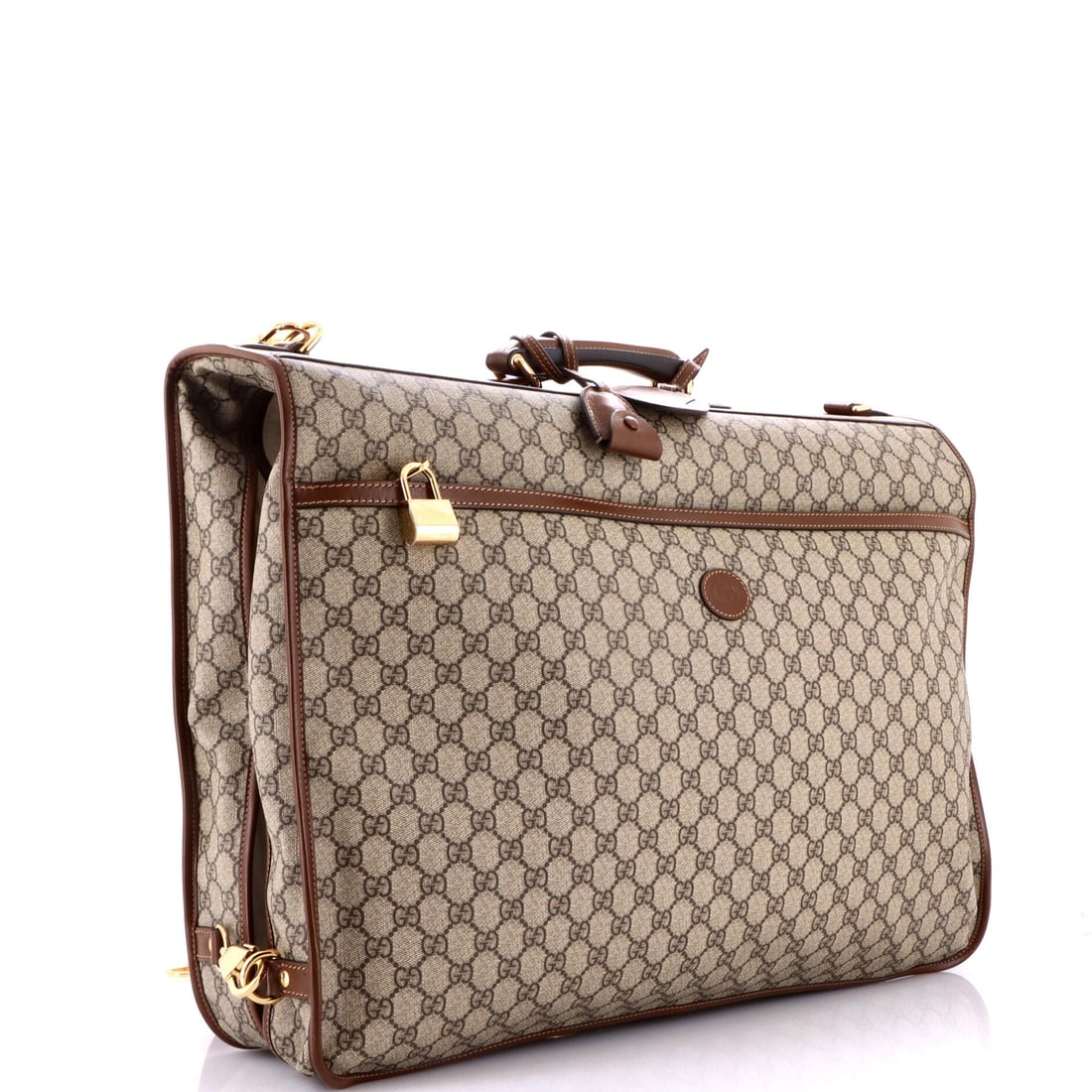 Gucci Retro Interlocking G Garment Bag GG Coated Canvas: At full read, the Garment Bag is exactly what the line has always promised: the long, hanging garment-carrier silhouette built for the wardrobe that travels with its tailoring intact. It is finished i