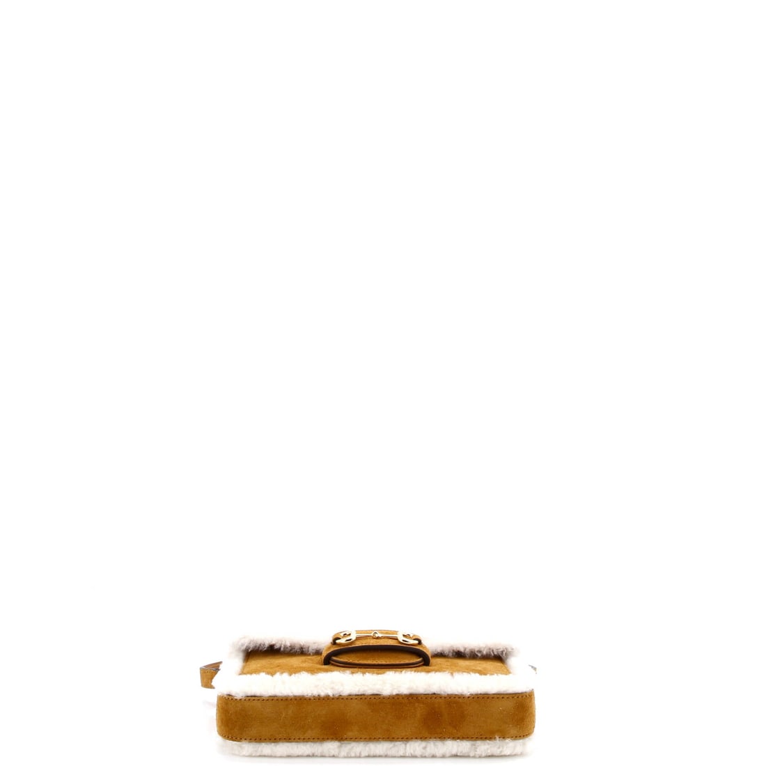 Gucci Horsebit 1955 Shoulder Bag Suede with Shearling: Examined closely, the Horsebit resolves around a single design idea: the silhouette the Gucci catalogue has always held the line on. Sized with a compact 5 by 8.5 by 2 inch profile, the proportion doe