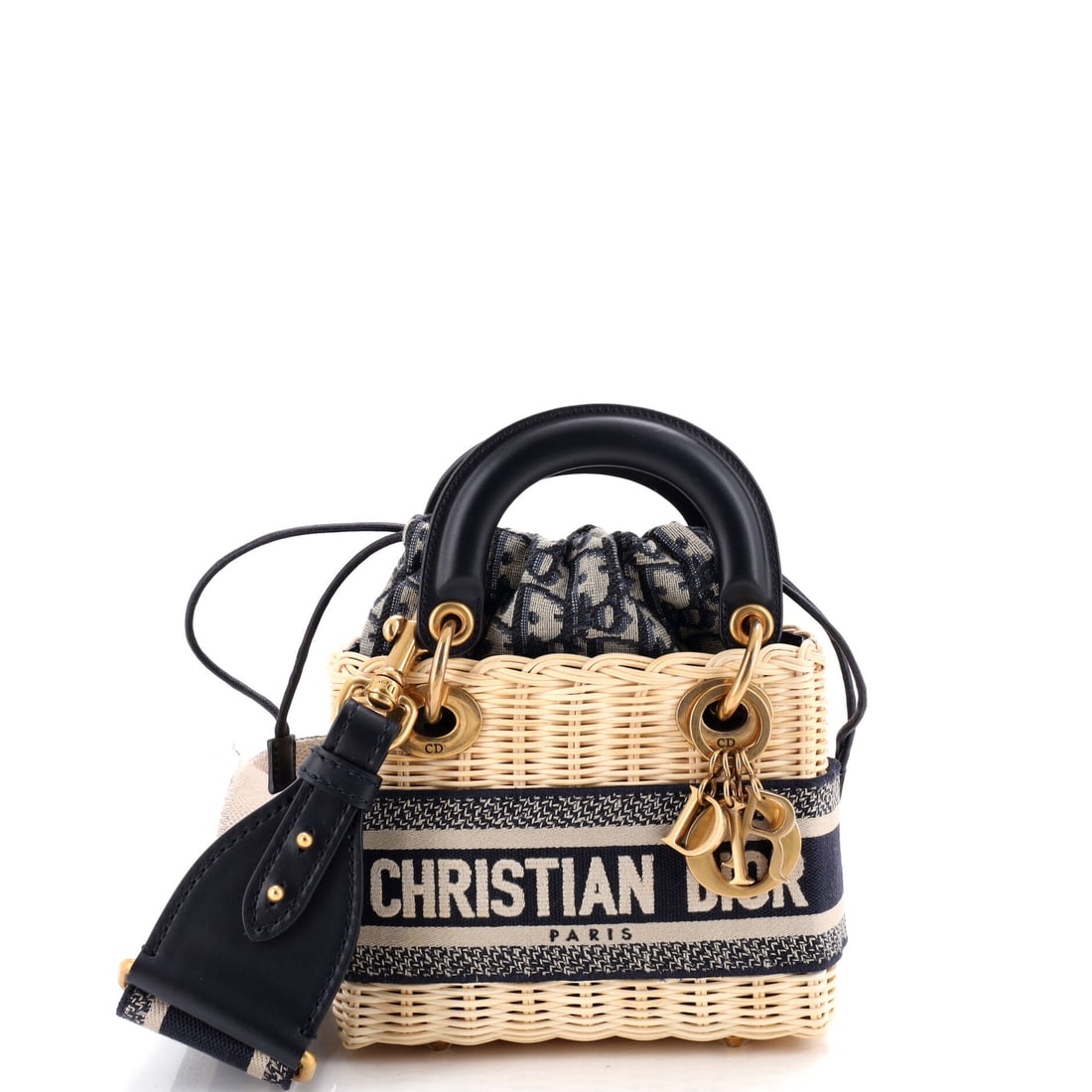Christian Dior Lady Dior Bag Wicker and Oblique Canvas: The Lady Dior arrives here in the form the line is known for: the structured top-handle silhouette with its cannage quilting and the four DIOR charms that finish each handle. Worked in Oblique - Dior'
