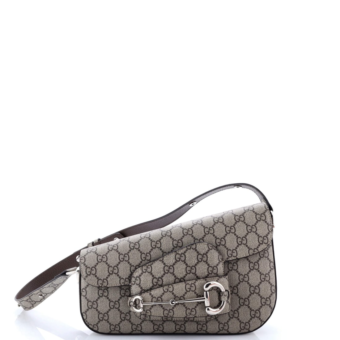Gucci Horsebit 1955 Asymmetric Shoulder Bag GG Coated Canvas: What anchors this Gucci Horsebit is precisely what anchors the line: the working silhouette the line is named for. It carries GG canvas - the coated cotton jacquard Gucci has carried since the 1960s, 