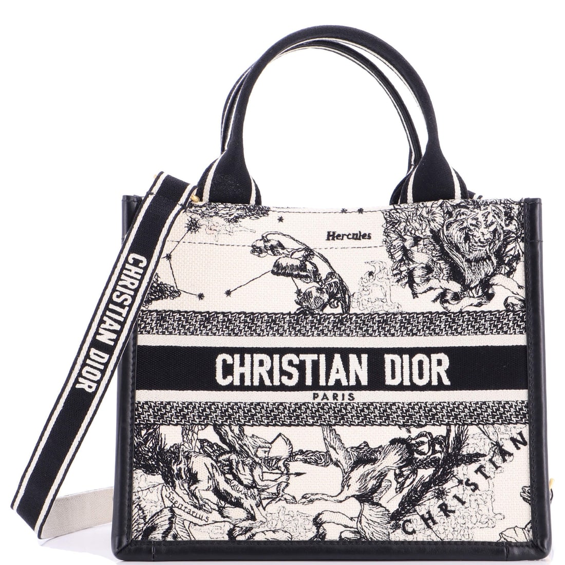 Christian Dior Book Tote with Strap Embroidered Canvas: Read this Book Tote against its lineage and the design choices line up exactly: the shoulder-strap accessory, drawn to the working hardware and material vocabulary the Christian Dior Book Tote line ha