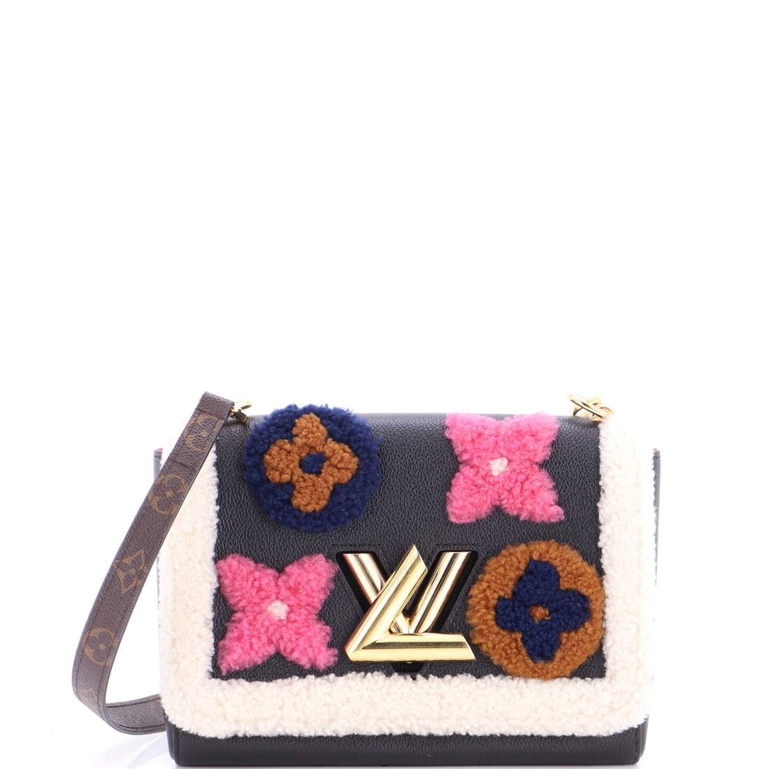 Louis Vuitton Twist Handbag Leather and Monogram Teddy Shearling: The reason the Twist continues to anchor the Louis Vuitton catalogue is simple: the twisting LV clasp Nicolas Ghesquiere drew for his first Vuitton collection in 2015. It carries Monogram canvas - the