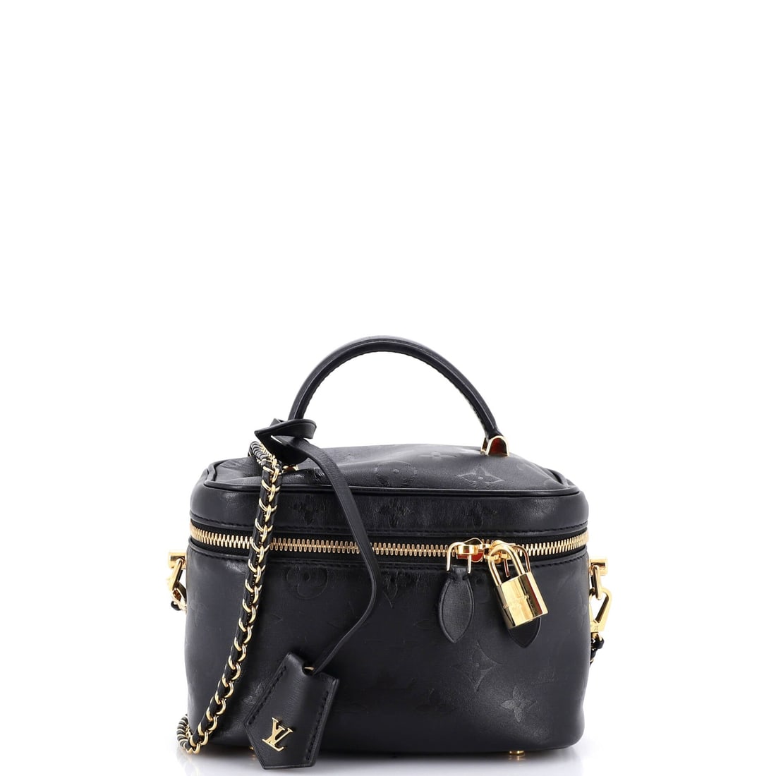 Louis Vuitton Vanity Handbag Monogram Ink Embossed Lambskin: Carried right, the Vanity reads as the house's working signature: the boxy, lipped-top silhouette descended from Vuitton's nineteenth-century travel vanity cases. Built from Monogram canvas - the prin