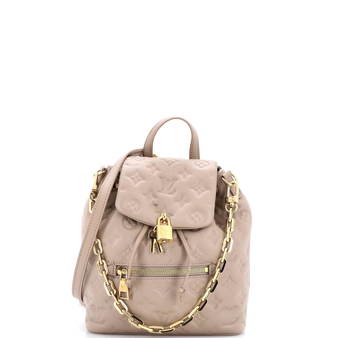 Louis Vuitton Coussin Backpack Monogram Embossed Lambskin: Properly seen, this Coussin carries the architecture the line has always relied on: the pillow-soft, lambskin-quilted silhouette Nicolas Ghesquiere introduced for Vuitton in 2021, with the chain-and-m