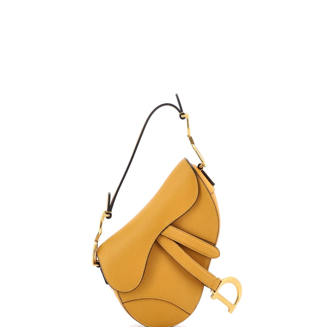 Christian Dior Saddle Handbag Leather: Open the Saddle once and the line announces itself: the asymmetric, stirrup-clasp silhouette John Galliano drew up for Dior in 1999. Its 6 by 7 by 2 inch footprint gives it a contained presence