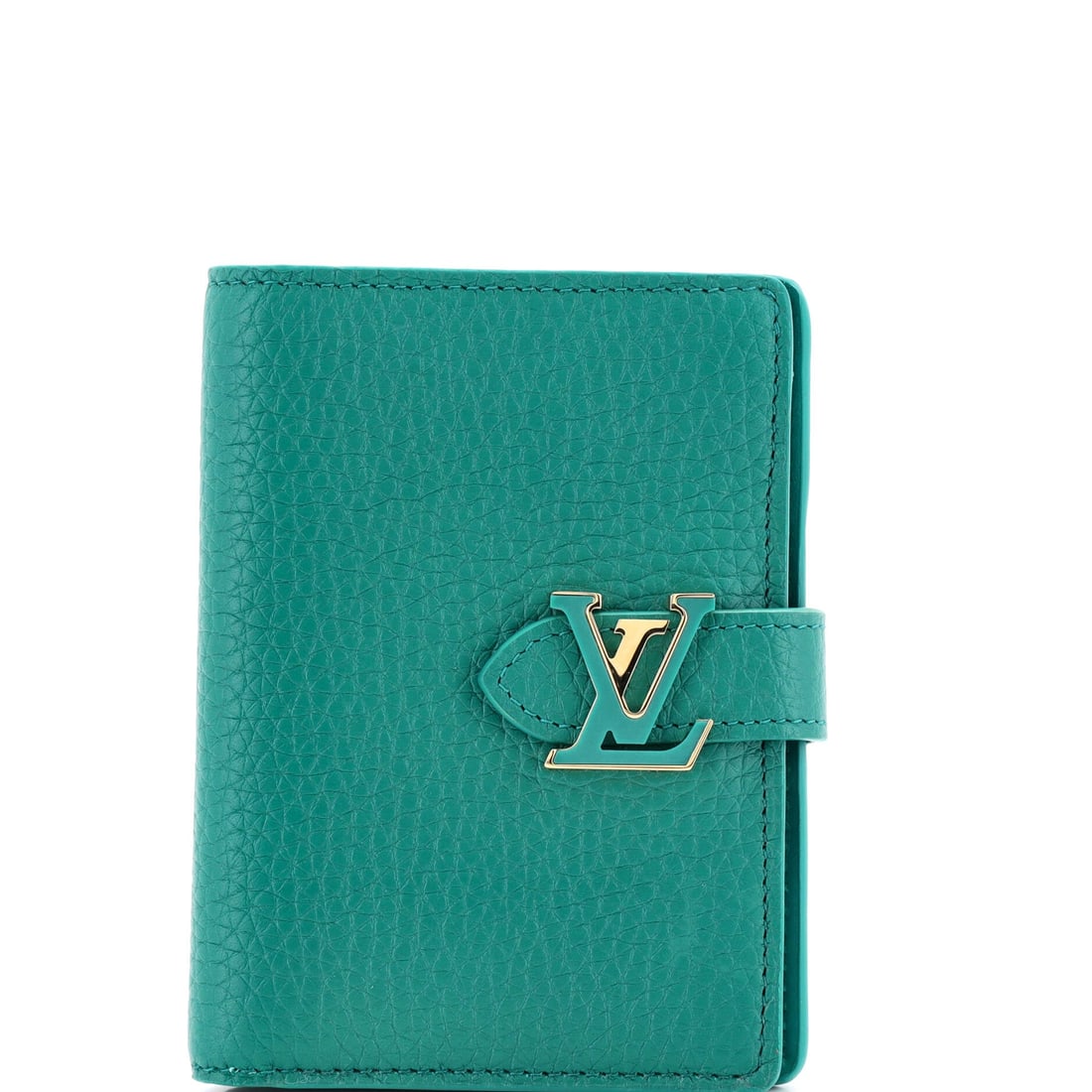 Louis Vuitton Capucines Vertical Wallet Leather: Stand the Capucines on a flat surface and the design logic shows itself - the proportion the line has kept across reissues. Its 5 by 3 by 1 inch footprint gives it a jewel-box presence without forcing