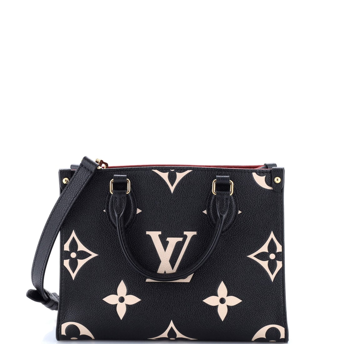 Louis Vuitton OnTheGo Tote Bicolor Monogram Empreinte Giant: Carried right, the OnTheGo reads as the house's working signature: the open-tote architecture with twin handles top and shoulder, sized to carry a laptop and a paperback in the same compartment.