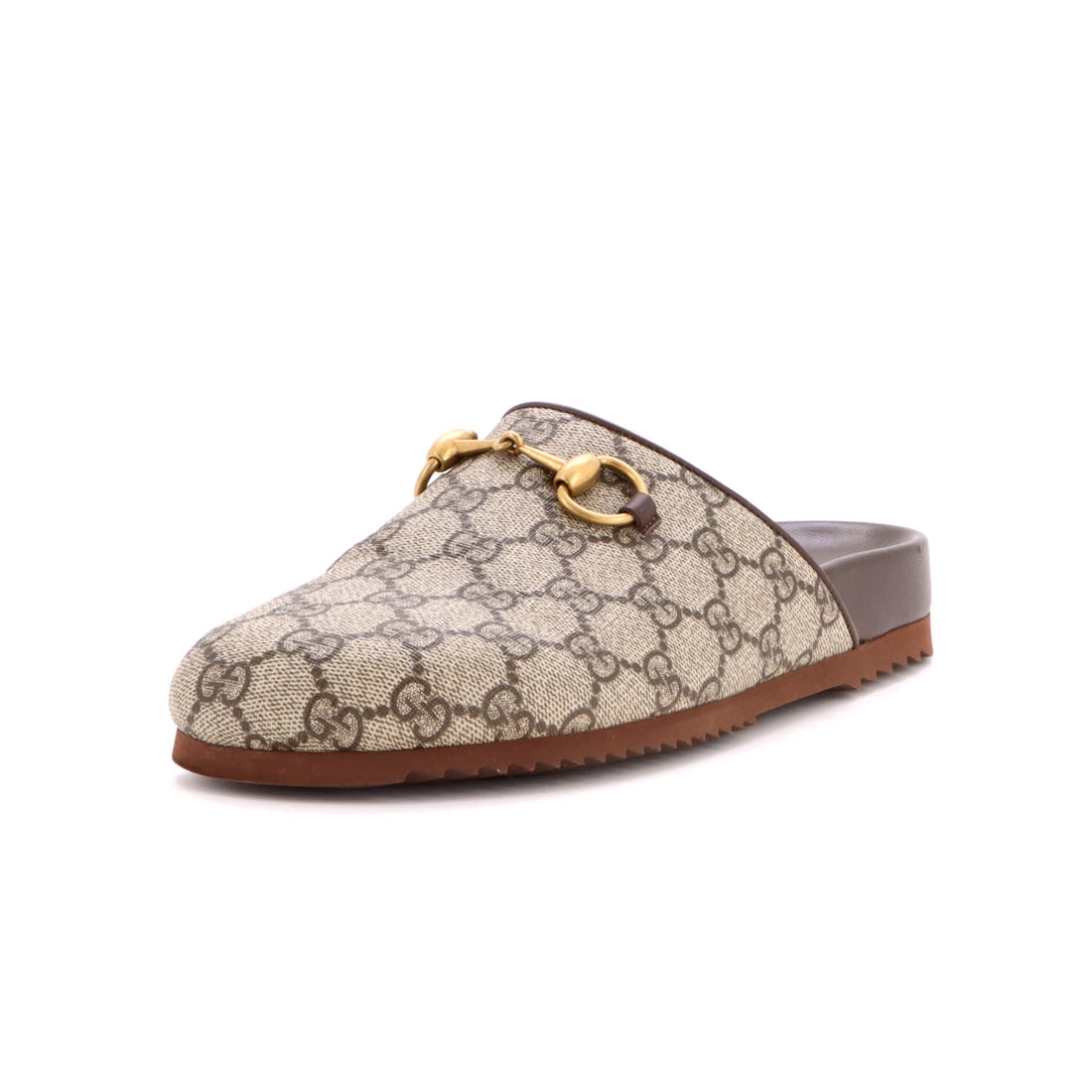 Gucci Horsebit Mule Slippers GG Coated Canvas: Picked up once, the Horsebit explains why the line has been kept in production this long: the shoe silhouette, drawn to the working hardware and material vocabulary the Gucci Horsebit line has stood
