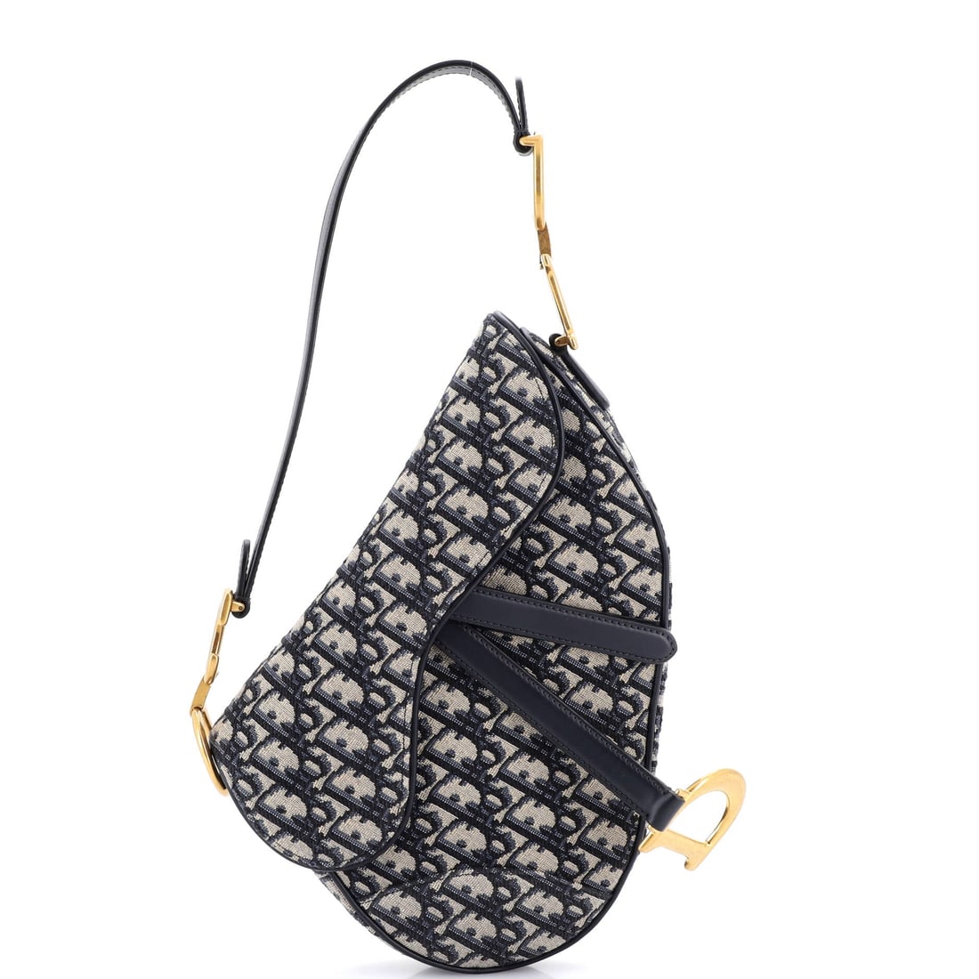 Christian Dior Saddle Handbag with Strap Oblique Canvas: Picked up once, the Saddle explains why the line has been kept in production this long: the shoulder-strap accessory, drawn to the working hardware and material vocabulary the Christian Dior Saddle li