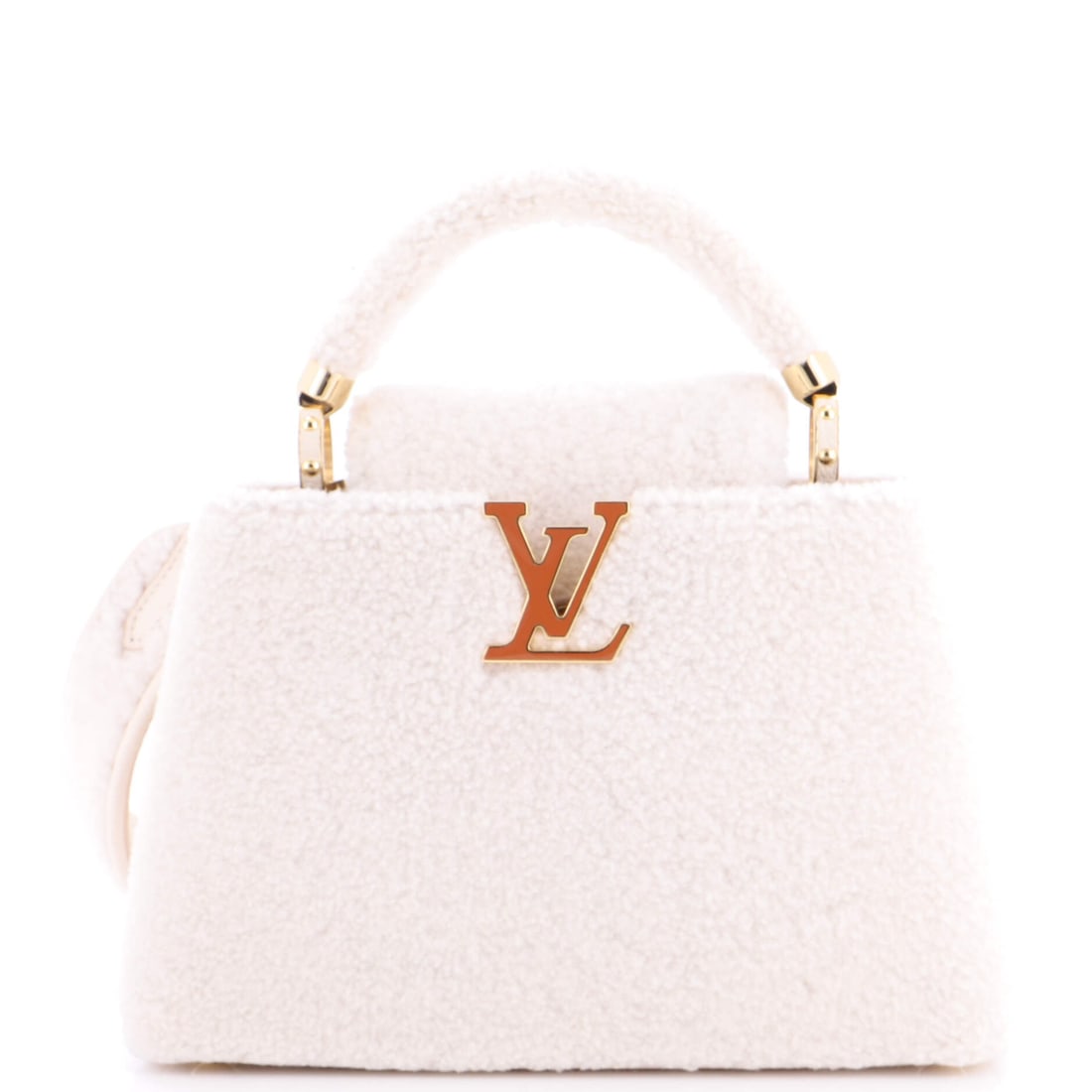 Louis Vuitton Capucines Bag Shearling: Louis Vuitton's Capucines arrives in the architecture that made the line known: the proportion the line has kept across reissues. Its 7 by 12 by 4 inch footprint gives it a true day-bag presence