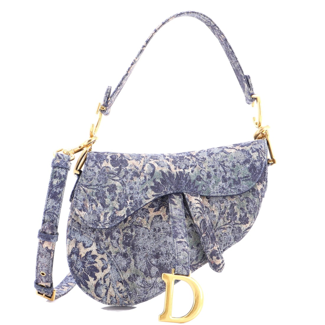 Christian Dior Saddle Handbag Printed Denim: Stand the Saddle on a flat surface and the design logic shows itself - the asymmetric, stirrup-clasp silhouette John Galliano drew up for Dior in 1999. Sized with a comfortable everyday 8 by 9.5 by 3 