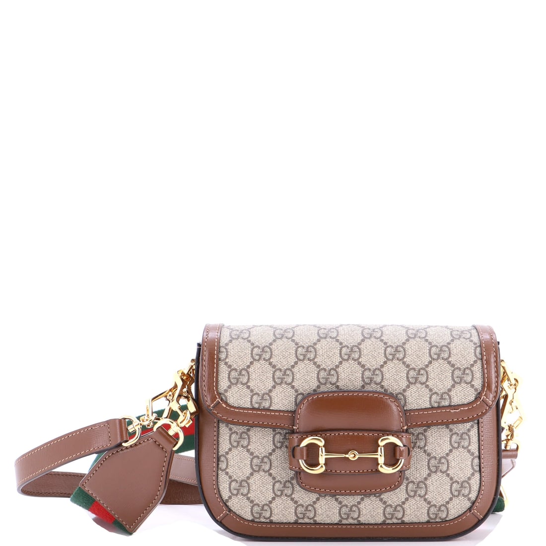 Gucci Horsebit 1955 Shoulder Bag GG Coated Canvas with Leather: The Horsebit arrives here in the form the line is known for: the form that anchors the line within the Gucci archive. It is rendered in GG canvas - the coated cotton jacquard Gucci has carried since t