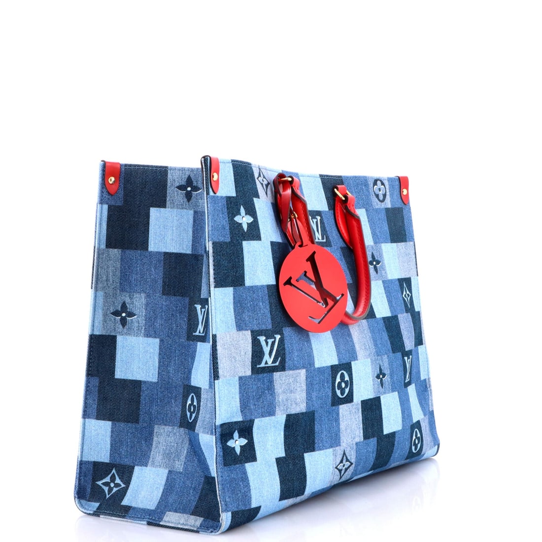 Louis Vuitton OnTheGo Tote Damier and Monogram Patchwork Denim: There is a reason the OnTheGo keeps returning to the conversation, and this Louis Vuitton example is part of it: the open-tote architecture with twin handles top and shoulder, sized to carry a laptop 
