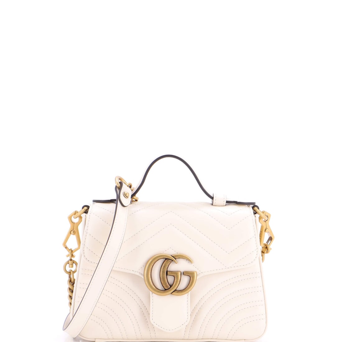 Gucci GG Marmont Top Handle Flap Bag Matelasse Leather: Set against its lineage, this Gucci Marmont reads as a measured example of the line, built around the quilted-leather flap silhouette finished with the antique-finish double-G clasp that names it. The