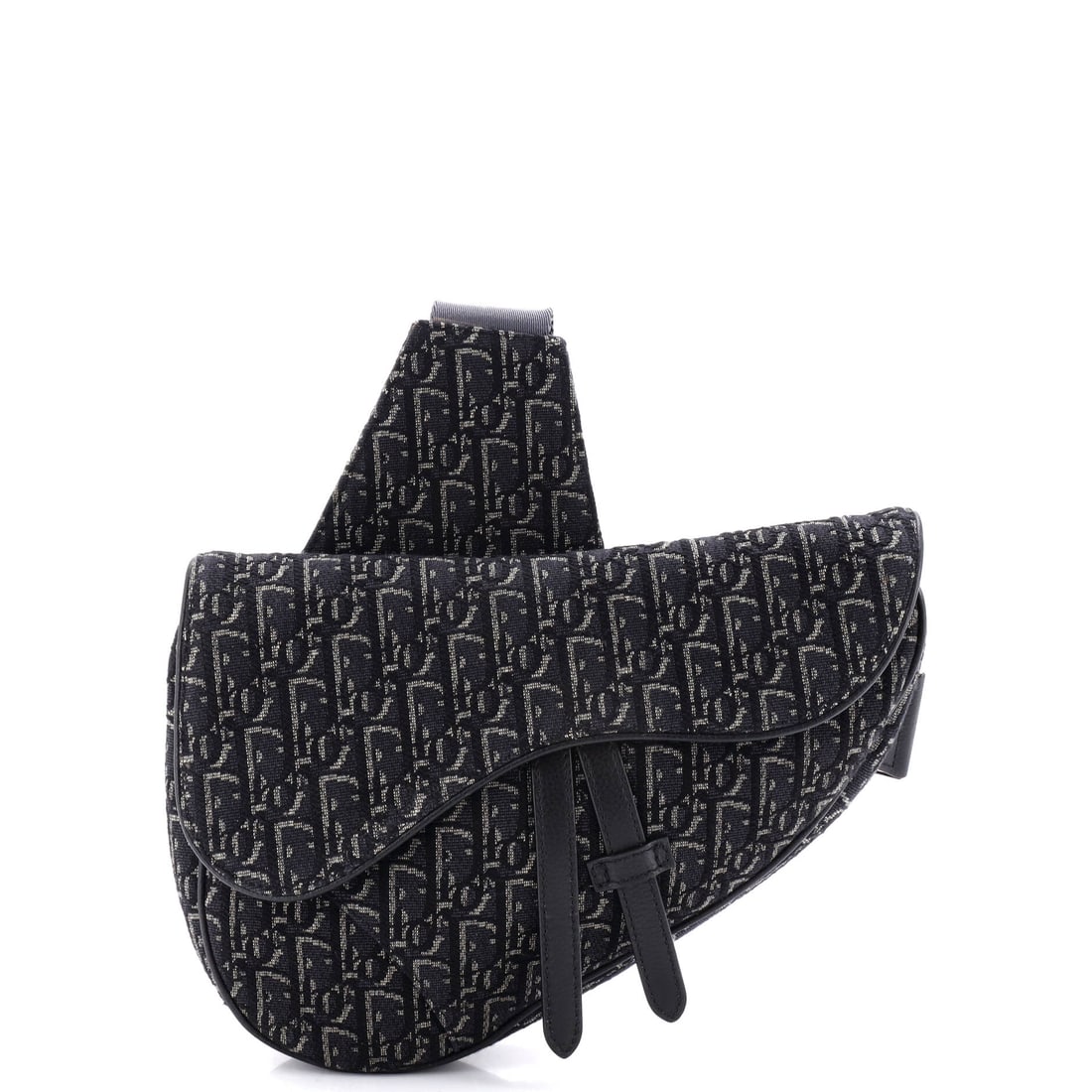 Christian Dior Saddle Crossbody Bag Oblique Canvas: Examined closely, the Saddle resolves around a single design idea: the asymmetric, stirrup-clasp silhouette John Galliano drew up for Dior in 1999. Built from Oblique - Dior's diagonal-monogram jacqua