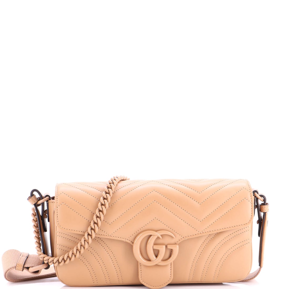 Gucci GG Marmont Monochrome Flap Bag Matelasse Leather: At full read, the Marmont is exactly what the line has always promised: the quilted-leather flap silhouette finished with the antique-finish double-G clasp that names it. The piece is finished in mate