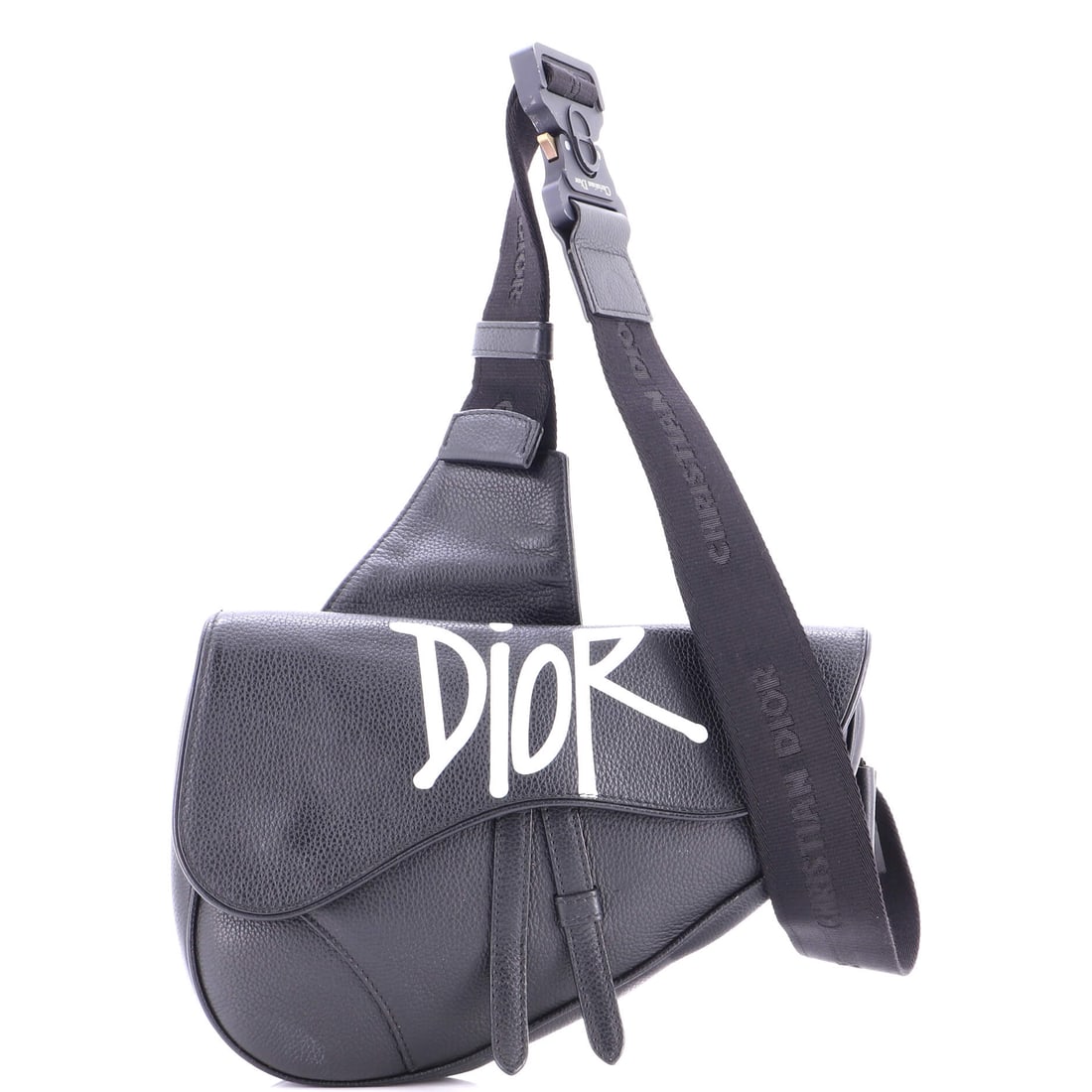 Christian Dior Shawn Stussy Saddle Crossbody Bag Printed Leather: This is the Saddle as the line is meant to read - the asymmetric, stirrup-clasp silhouette John Galliano drew up for Dior in 1999, in the proportions Christian Dior has held since debut. Sized with a 