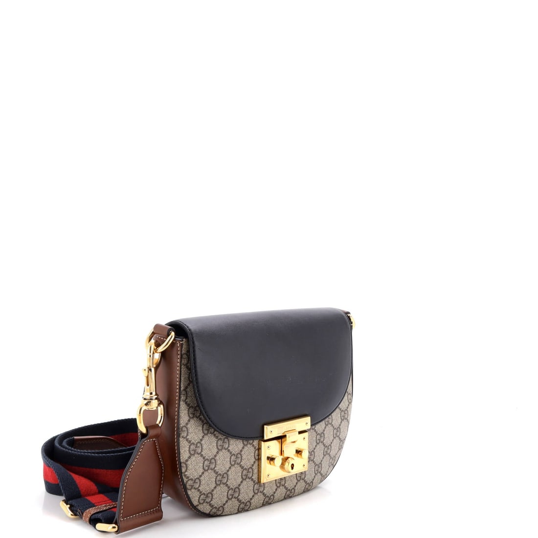 Gucci Padlock Saddle Shoulder Bag GG Coated Canvas and Leather: The reason the Padlock continues to anchor the Gucci catalogue is simple: the flap silhouette closed by the padlock-and-key hardware that names it. It carries GG canvas - the coated cotton jacquard Gu