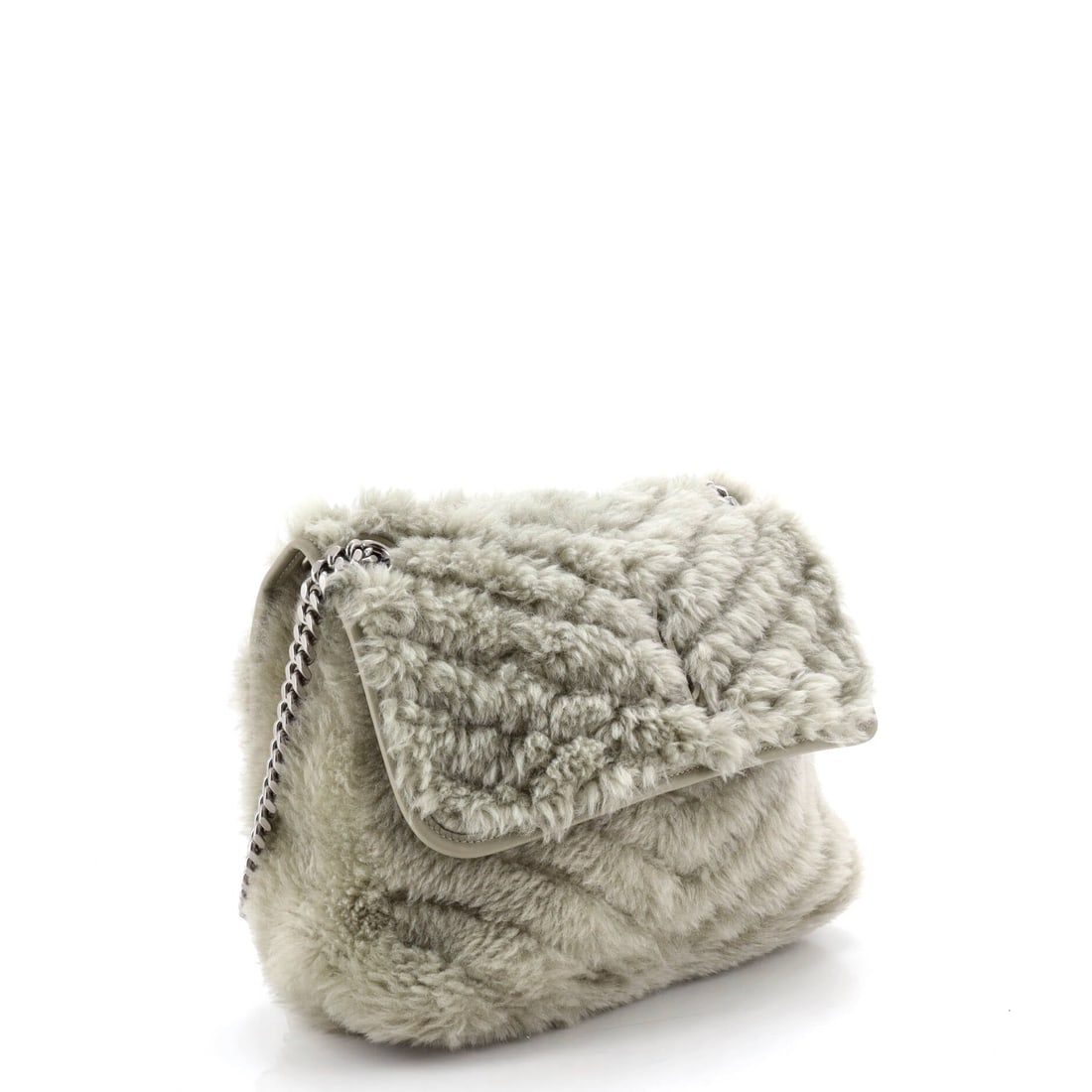 Saint Laurent Niki Chain Flap Bag Matelasse Chevron Shearling Medium: Built around the Saint Laurent Niki Chain Flap Bag silhouette in the Medium size and presented in matelasse chevron shearling, this carry favors line over volume and substance over flash. Sized with a