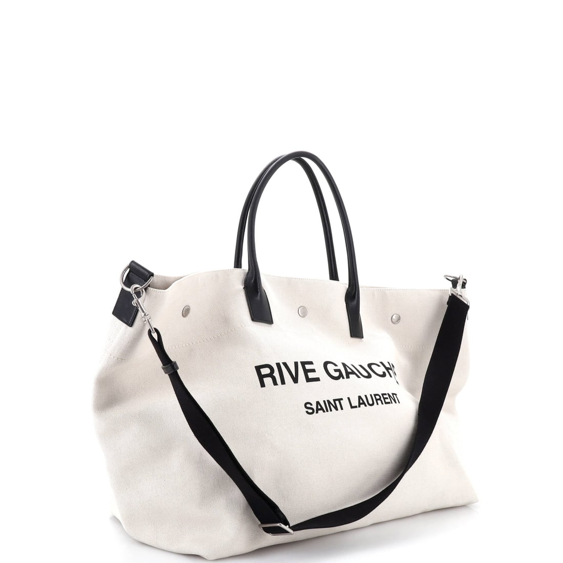 Saint Laurent Rive Gauche Shopper Tote Canvas Maxi: Built around the Saint Laurent Rive Gauche Shopper Tote silhouette in the Maxi size and presented in canvas, this carry favors line over volume and substance over flash. Sized with a 16.5 by 20 by 10.