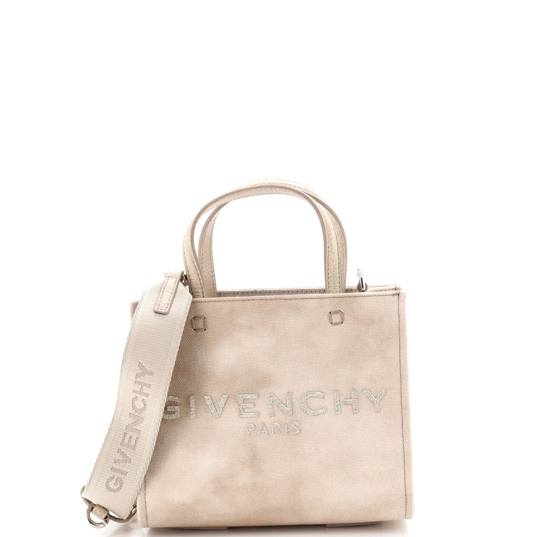 Givenchy G-Tote Canvas Mini: The G-Tote is one of Givenchy's most translatable silhouettes, a piece that adjusts to its wearer rather than the other way around. It is constructed in Canvas, with the kind of considered finish the