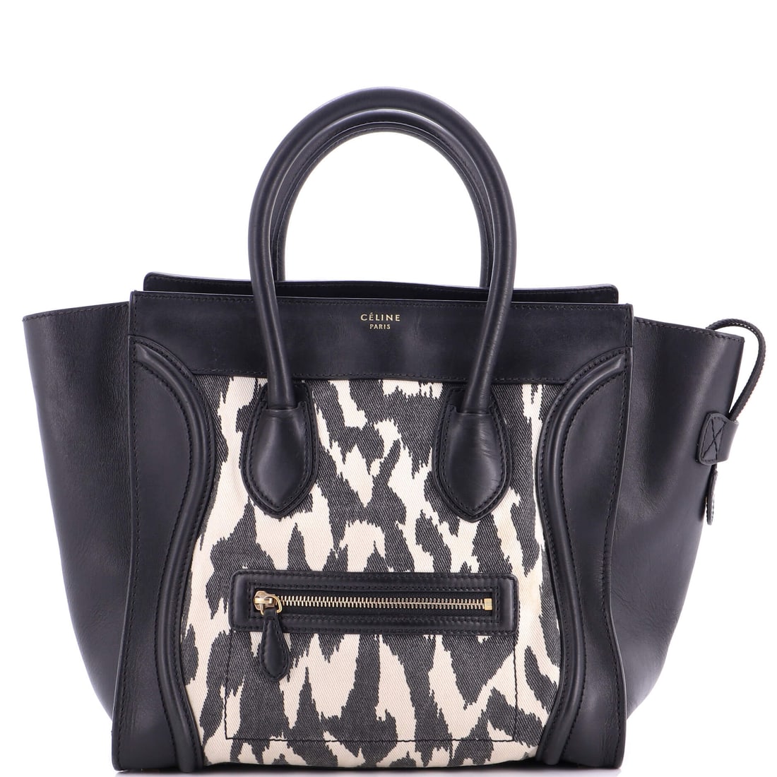 Celine Luggage Bag Printed Canvas and Leather Mini: Celine built the Luggage Bag as a piece that holds its own in a wardrobe rather than competing with it. Worked in Printed Canvas and Leather, the surface carries a measured, well-bred polish. Measured