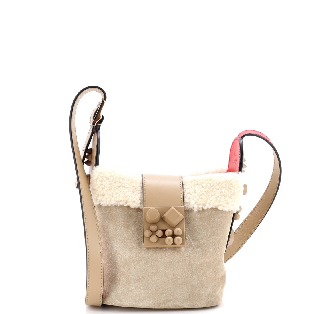 Christian Louboutin Carasky Bucket Bag Suede with Shearling Mini: Within Christian Louboutin's catalog, the Carasky Bucket Bag occupies the territory between everyday tote and editorial carry. It carries the unmistakable hand of shearling, the plush sheepskin worn p