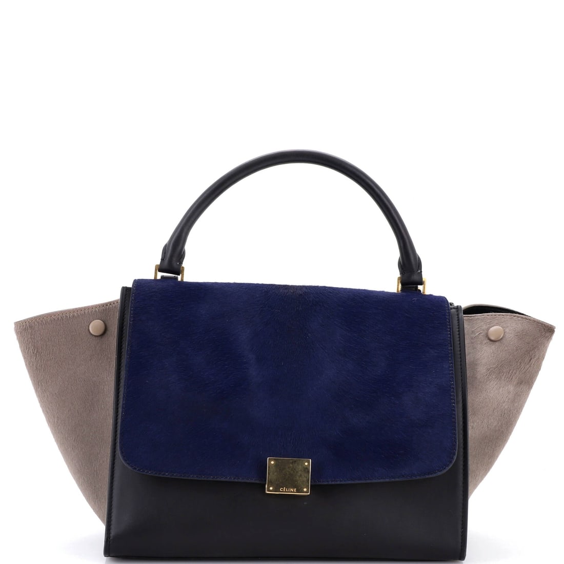 Celine Tricolor Trapeze Bag Pony Hair Medium: The Tricolor Trapeze Bag from Celine reads as a thoughtful piece of bag-making, with construction that prioritizes posture and proportion over noise. It is constructed in Pony Hair, with the kind of c