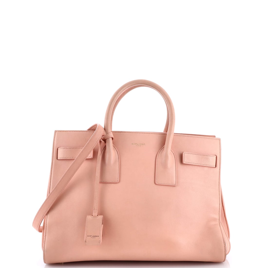 Saint Laurent Sac de Jour Bag Leather Small: The Sac de Jour Bag is one of Saint Laurent's most translatable silhouettes, a piece that adjusts to its wearer rather than the other way around. Cut in Leather, it has the considered hand a careful c