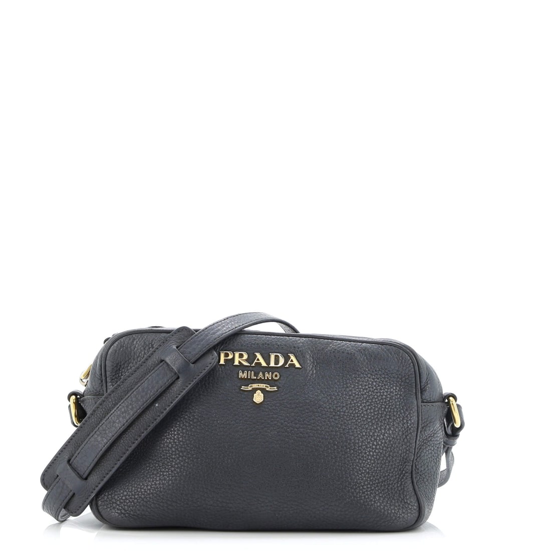 Prada Dual Strap Camera Bag Vitello Daino: Prada built the Dual Strap Camera Bag as a piece that holds its own in a wardrobe rather than competing with it. It is constructed in Vitello Daino, with the kind of considered finish the house is kno