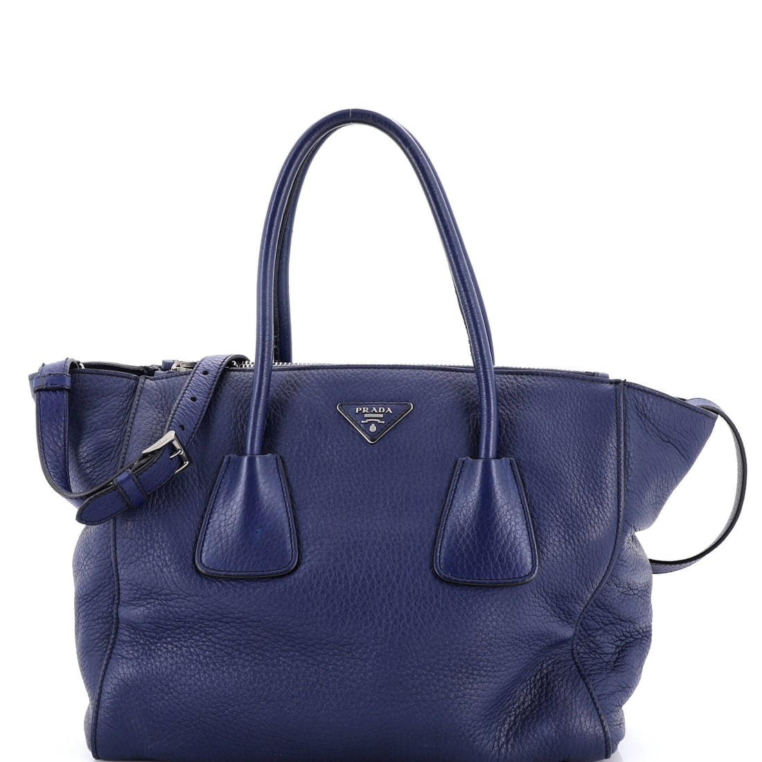 Prada Twin Pocket Leather Large: The Prada Twin Pocket carries a stance the maison has refined across many iterations into something instantly recognizable. It is constructed in Leather, with the kind of considered finish the house i