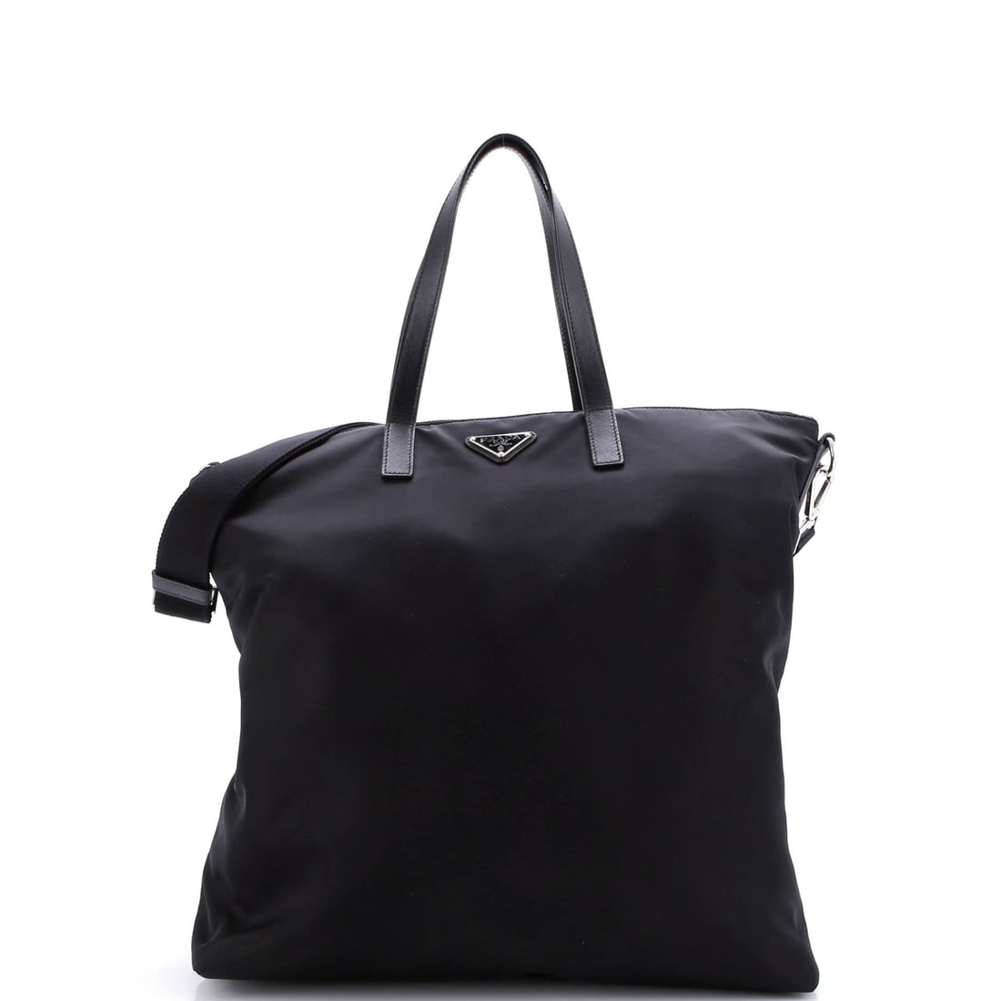 Prada Vela Zip Top Convertible Tote Tessuto Large: Prada's Vela Zip Top Convertible Tote is a study in measured architecture, the kind of carry that telegraphs taste before it ever signals brand. It carries the unmistakable hand of tessuto, Prada's si