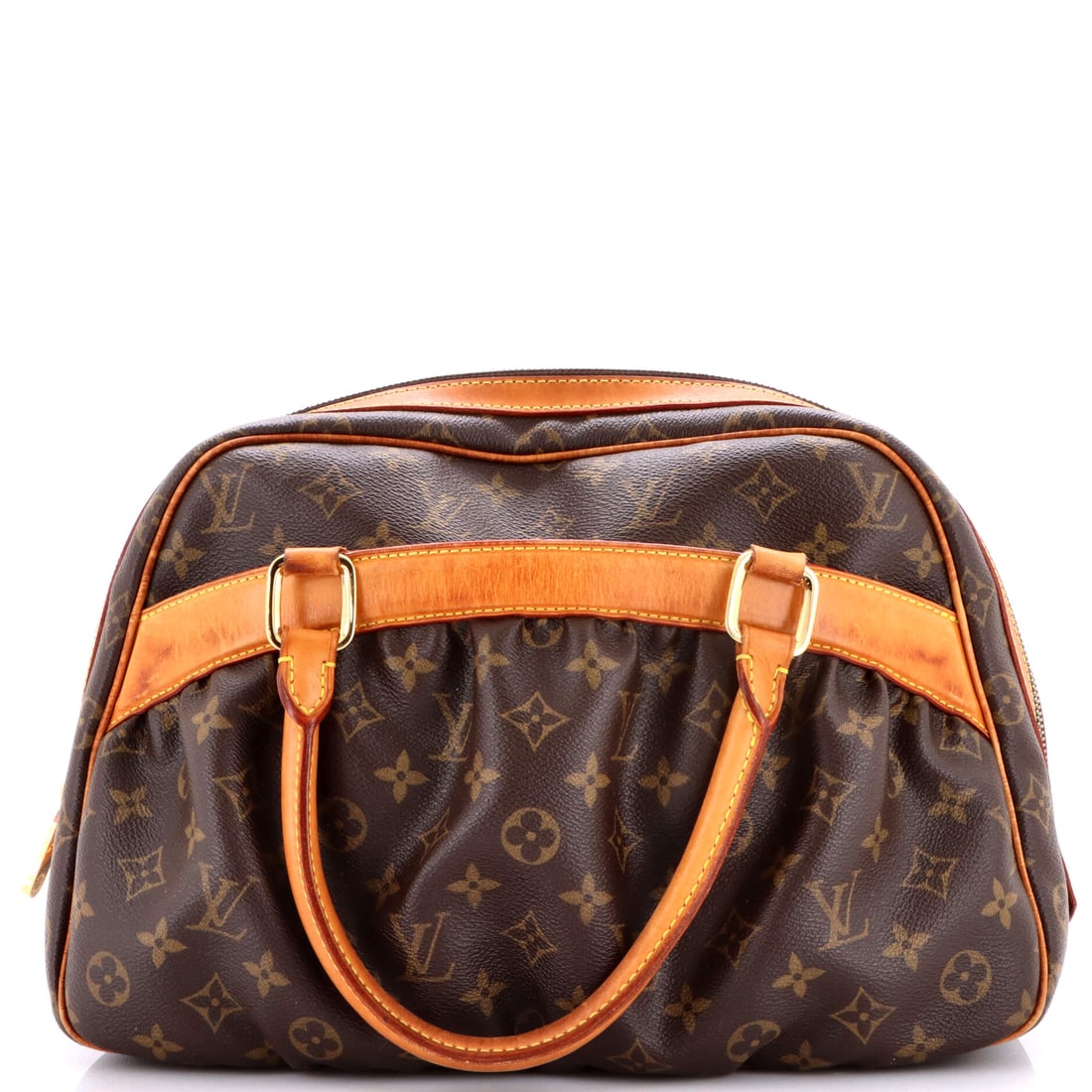 Louis Vuitton Mizi Handbag Monogram Canvas: Presented here, the Louis Vuitton Mizi Handbag arrives with the proportions and stance that the house refined into a recognizable signature. It is finished in Monogram coated canvas, the house's