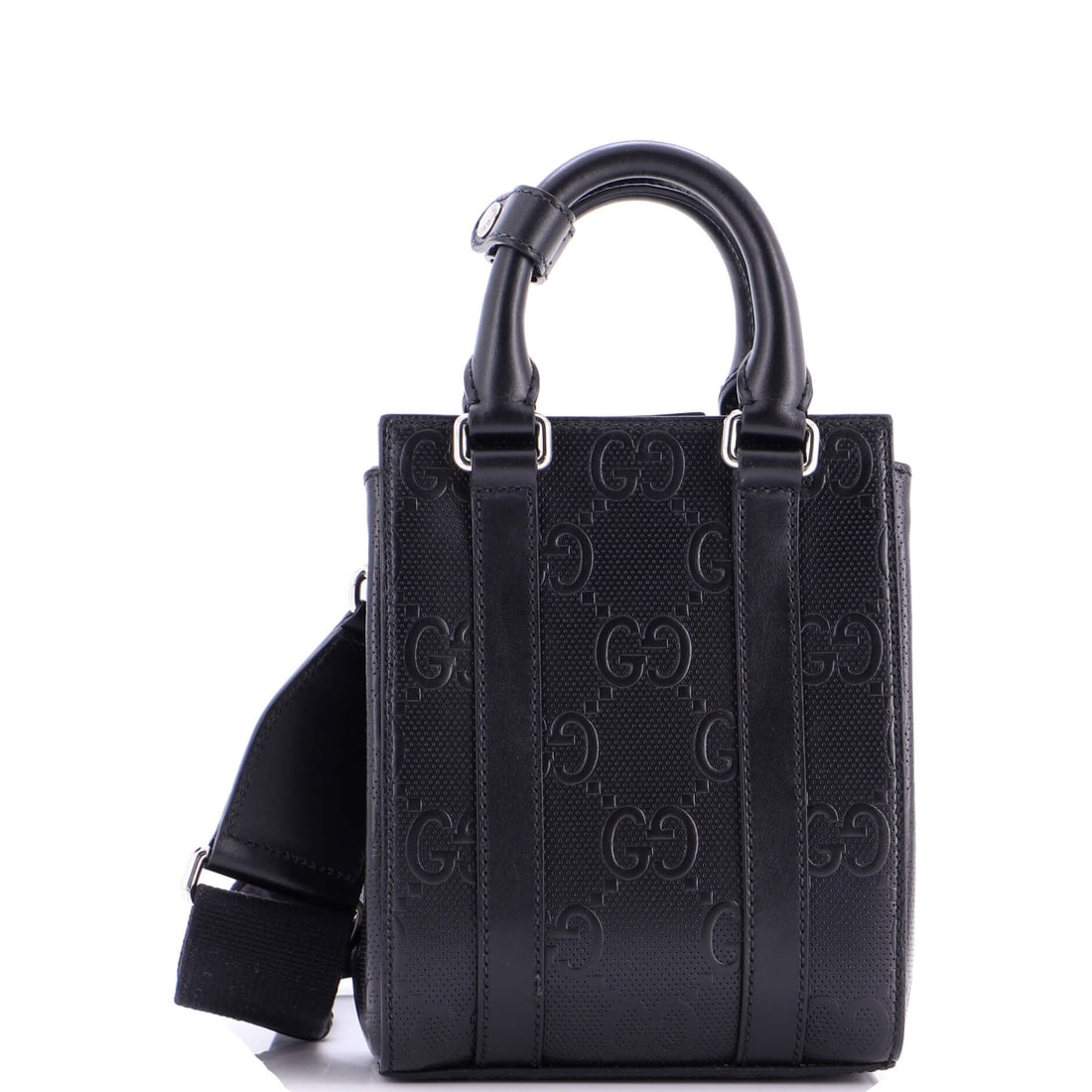 Gucci Vertical Tote GG Embossed Perforated Leather Mini: The Vertical Tote from Gucci reads as a thoughtful piece of bag-making, with construction that prioritizes posture and proportion over noise. Cut in GG Embossed Perforated Leather, it has the