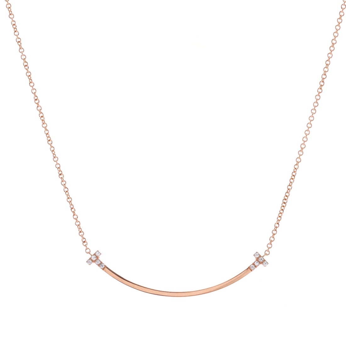 Tiffany & Co. T Smile Pendant Necklace 18K Rose Gold and Diamonds Small: Anchored in polished gold, the Tiffany & Co. T Smile Pendant Necklace carries its motif with quiet authority. Worked in 18K Rose Gold and Diamonds. The chain length reads as classic mid-collar, where 