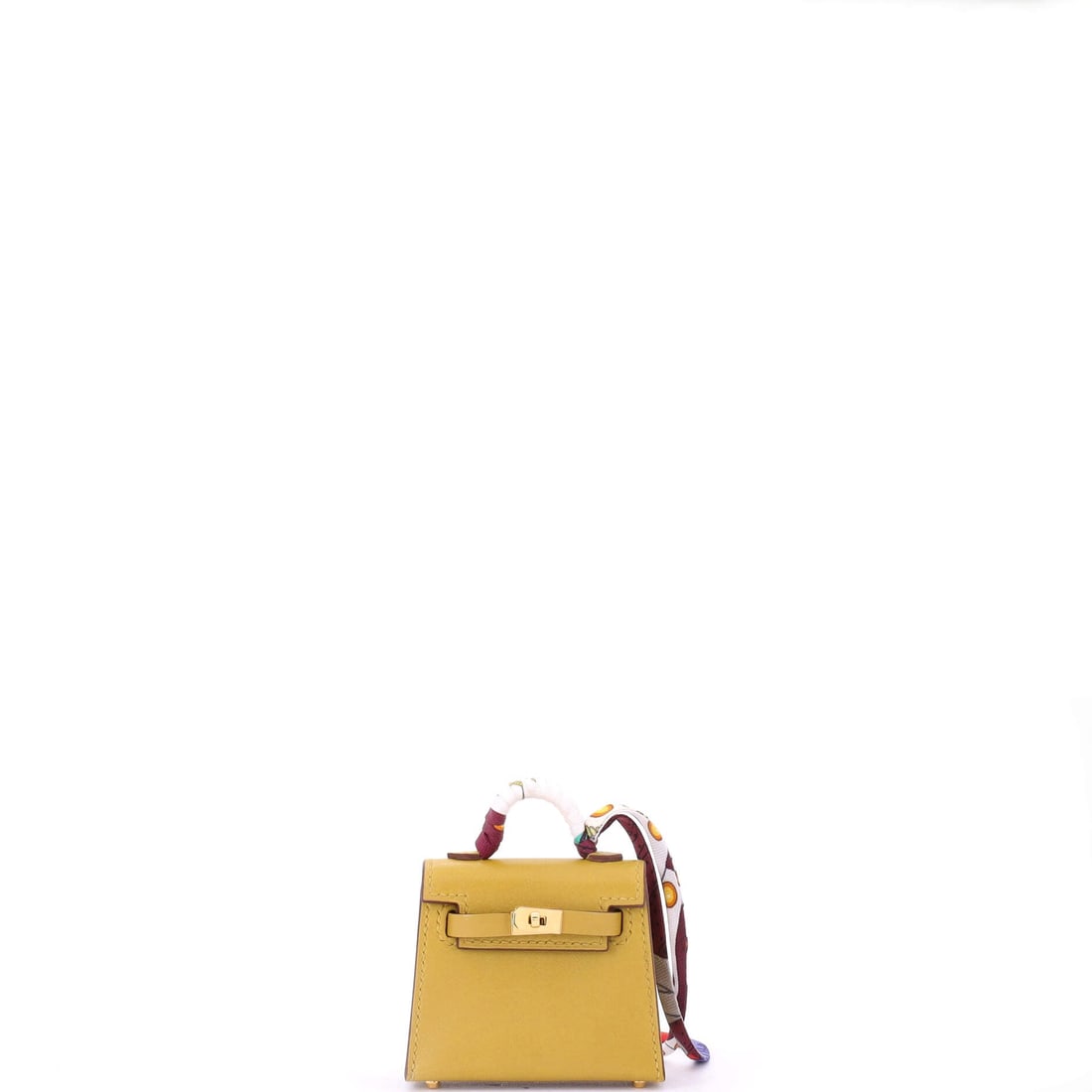 Hermes Kelly Twilly Bag Charm Tadelakt: Built as a charm, the Hermes Kelly Twilly Bag Charm clips neatly onto a chain, a strap, or a bag handle. Worked in Tadelakt. The proportion is judged for real wear, more talisman than statement. It cl