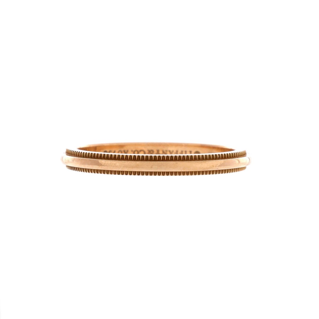 Tiffany & Co. Classic Milgrain Band Ring 18K Rose Gold 2mm: Stack-tuned, the Tiffany & Co. Classic Milgrain Band Ring keeps its band proportion exactly where the hand wants it. Worked in 18K Rose Gold. Mass-wise it lands in the comfortable mid-weight band that