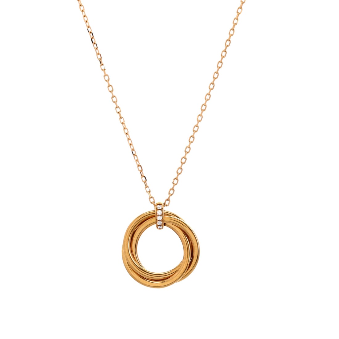 Cartier Trinity Pendant Necklace 18K Yellow Gold and Diamonds: Architecturally restrained, the Cartier Trinity Pendant Necklace balances proportion with a piece-of-jewelry confidence. Worked in 18K Yellow Gold and Diamonds. Its proportions slip cleanly under a co