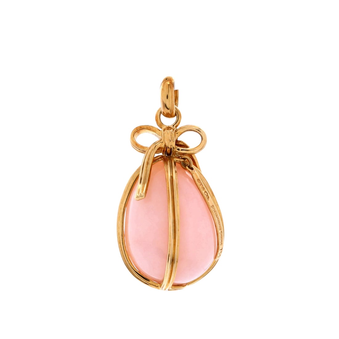 Tiffany & Co. Egg Charm Pendant 18K Yellow Gold and Pink Opal: Chain-led, the Tiffany & Co. Egg Charm Pendant translates a house motif into a wearable signature. Worked in 18K Yellow Gold and Pink Opal. Sized at 29.9 by 15 inches, the proportion reads as delibera