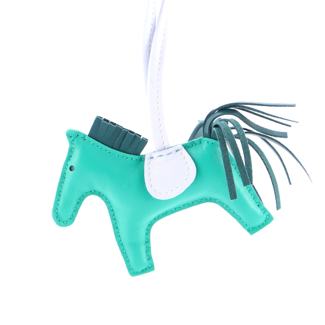 Hermes GriGri Rodeo Bag Charm Leather MM: Pocket-scaled, the Hermes GriGri Rodeo Bag Charm clips neatly onto a chain, a strap, or a bag handle. Worked in Leather. Sized at 3 by 3 by 1 inches, the proportion reads as deliberate without being o