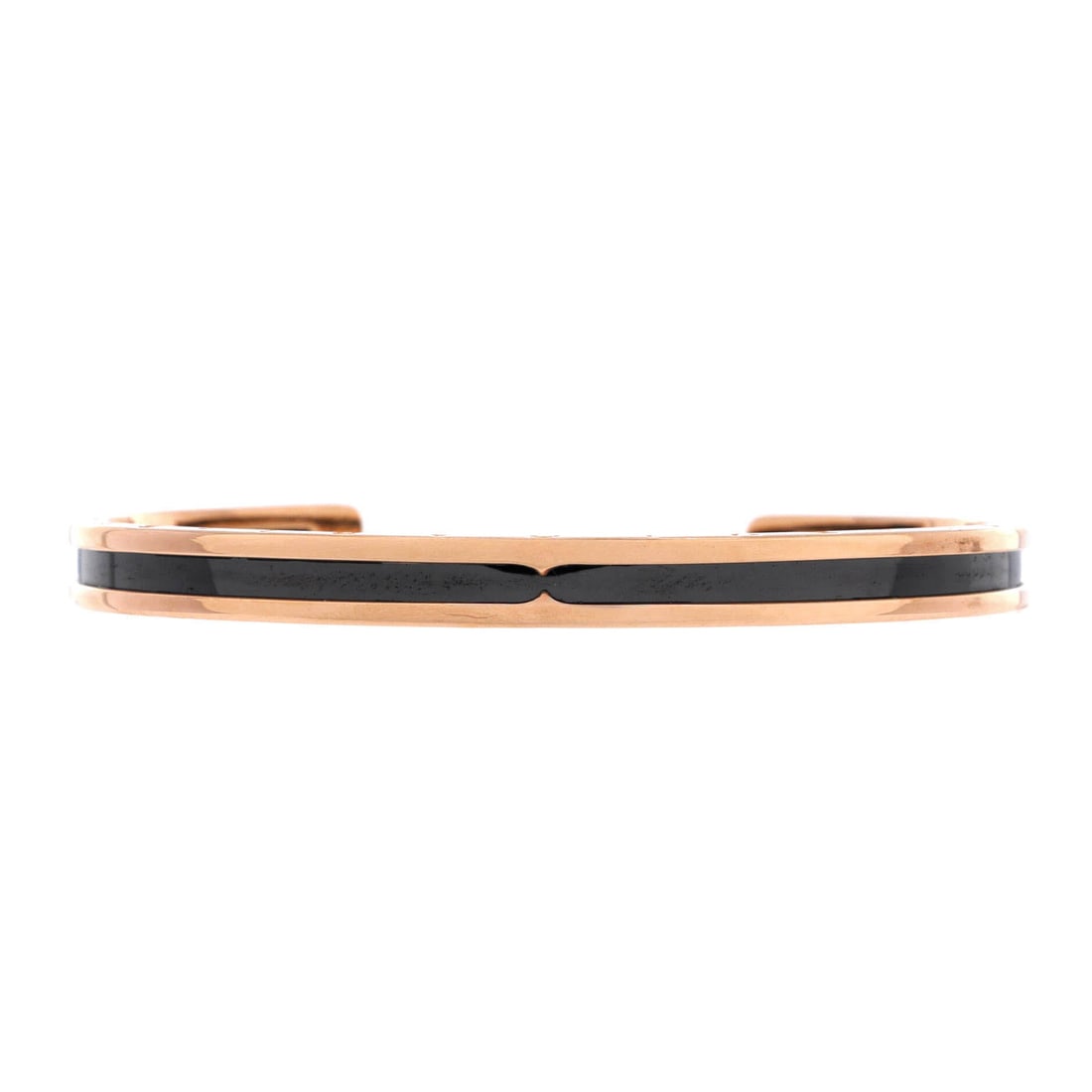 Bvlgari B.Zero1 Cuff Bracelet 18K Rose Gold and Coated Stainless Steel: Sculpted in rose gold, the Bvlgari B.Zero1 Cuff Bracelet sits as low-profile as it does deliberate. Worked in 18K Rose Gold and Coated Stainless Steel. The articulation traces the wrist closely, so it
