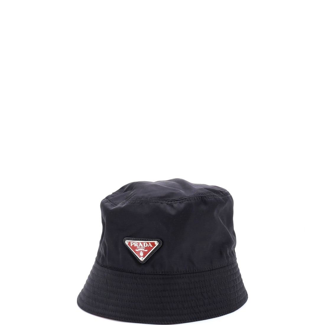 Prada Logo Bucket Hat Re-Nylon: Chignon-tuned, the Prada Logo Bucket Hat reads as a deliberate finishing detail rather than an afterthought. Worked in Re-Nylon. The proportion is judged for real wear, more talisman than statement. I