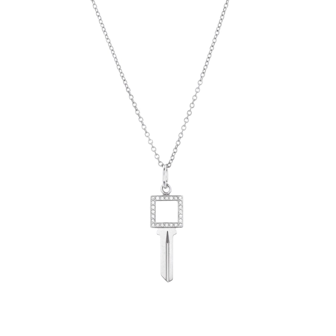 Tiffany & Co. Modern Open Square Key Pendant Necklace 18K White Gold with Diamonds: Tuned to wear, the Tiffany & Co. Modern Open Square Key Pendant Necklace reads as both ornament and quiet emblem. Worked in 18K White Gold with Diamonds. Its proportions slip cleanly under a collar