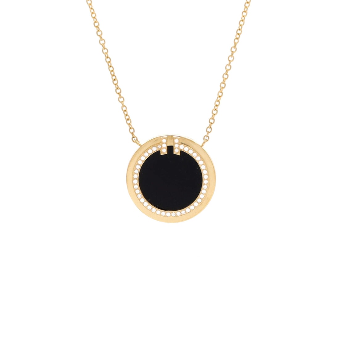 Tiffany & Co. T Circle Pendant Necklace 18K Yellow Gold with Onyx and Diamonds Large: Layered to wear, the Tiffany & Co. T Circle Pendant Necklace reads with the kind of clean line that holds attention without raising its voice. Worked in 18K Yellow Gold with Onyx and Diamonds. The cha