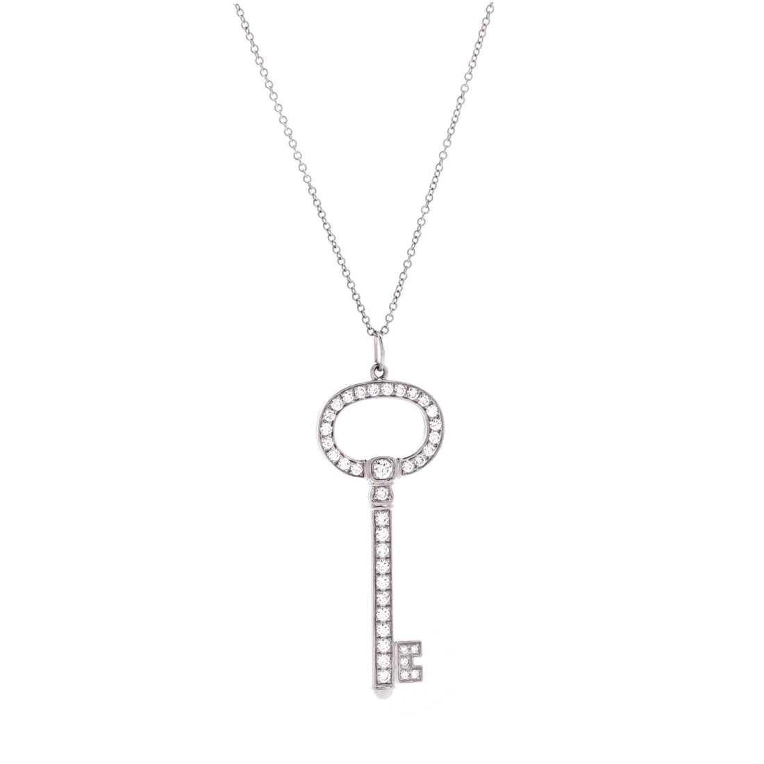 Tiffany & Co. Oval Key Pendant Necklace Platinum with Diamonds Small: Architecturally restrained, the Tiffany & Co. Oval Key Pendant Necklace sits with elegant intent against the collarbone. Worked in Platinum with Diamonds. Its proportions slip cleanly under a collar y
