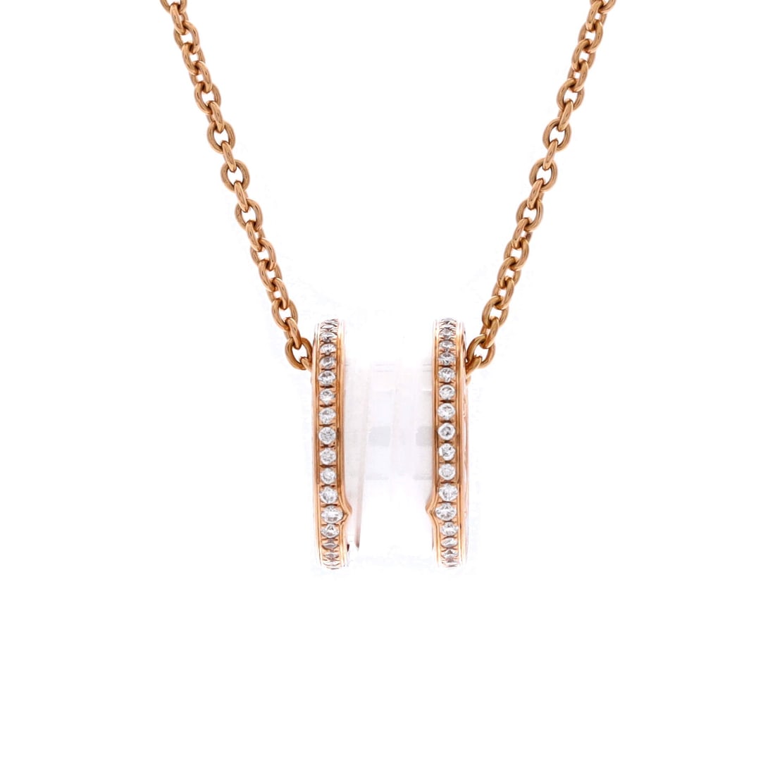 Bvlgari B.Zero1 Pendant Necklace 18K Rose Gold and Ceramic with Diamonds: Worked in rose gold, the Bvlgari B.Zero1 Pendant Necklace positions its centerpiece exactly where the eye lands first. Worked in 18K Rose Gold and Ceramic with Diamonds. Scale-wise it lives in the swe